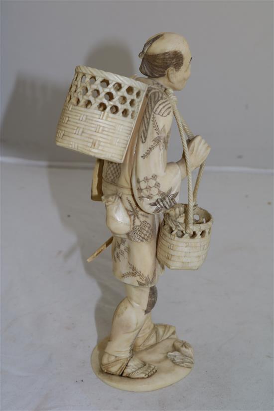 A Japanese sectional ivory figure of a fisherman, early 20th century, 23.5cm